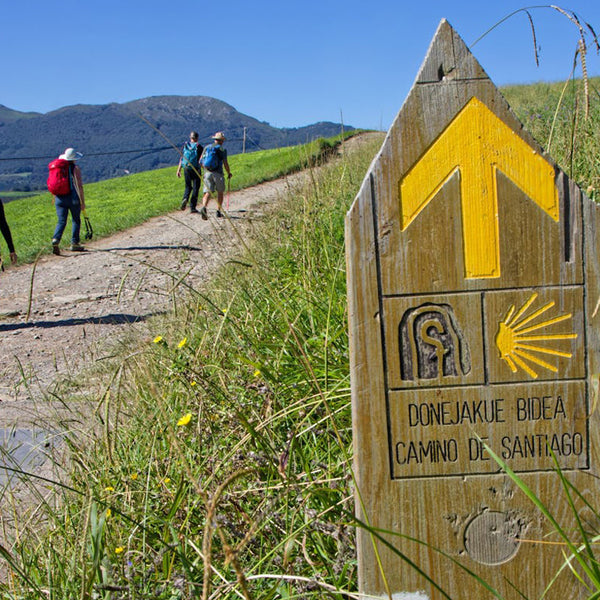 Man Taking Photo on the Camino wearing a Lowe Alpine Backpack