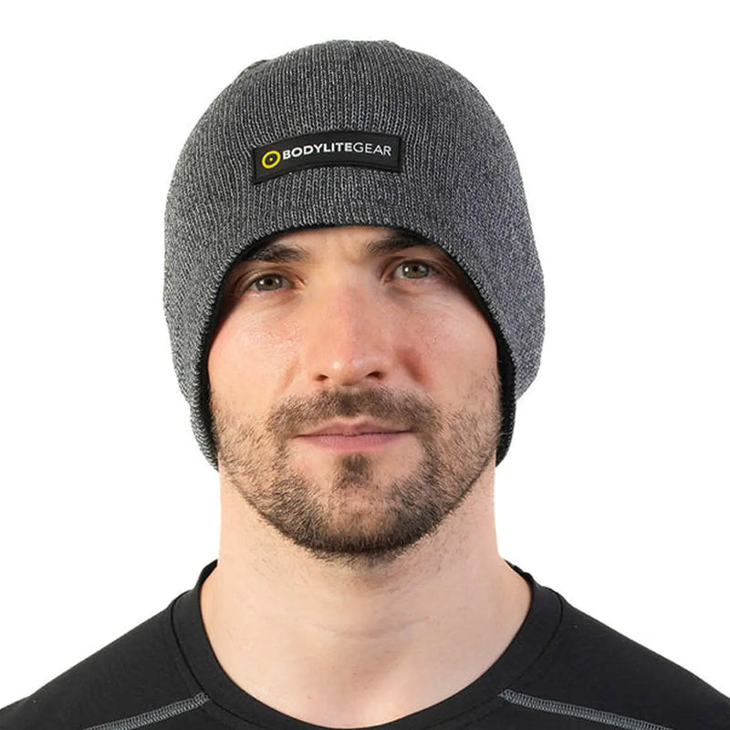 Stay visible and warm with the Bodylite Reflective Beanie. Dual-layer design and 360-degree reflectivity.