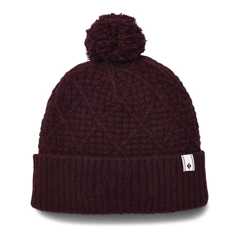 Discover the Black Diamond Cable Cuff Pom Beanie, crafted from a wool-blend for ultimate warmth and style.